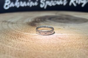 Design – Diamond Cuts Bahraini silver engagement band