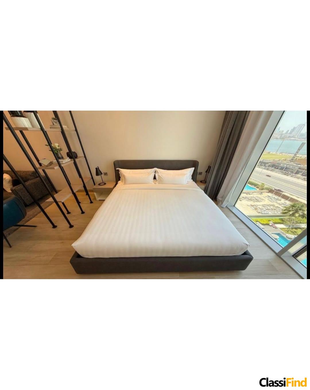 A luxurious, fully furnished studio apartment with a sea view