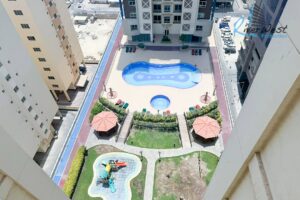 Rent in Al Juffair — 2-bedroom flat with balcony + pool view 🏙️🏊‍♂️