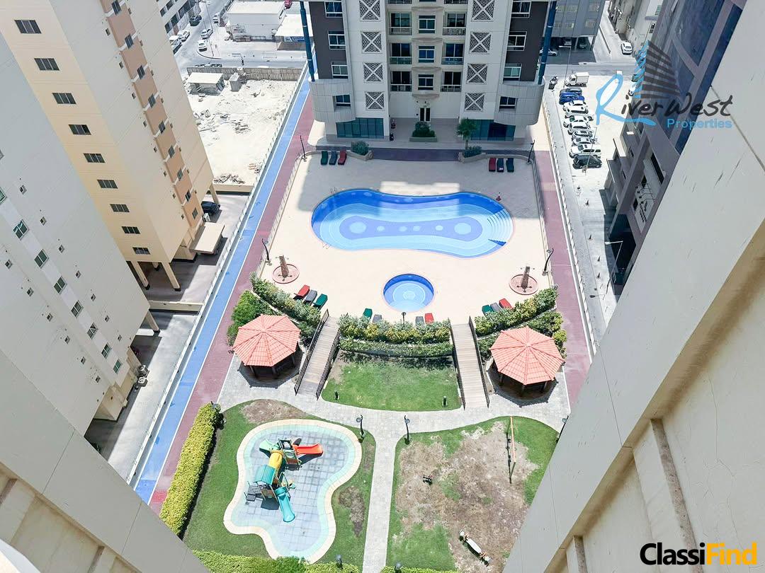 Rent in Al Juffair — 2-bedroom flat with balcony + pool view 🏙️🏊‍♂️